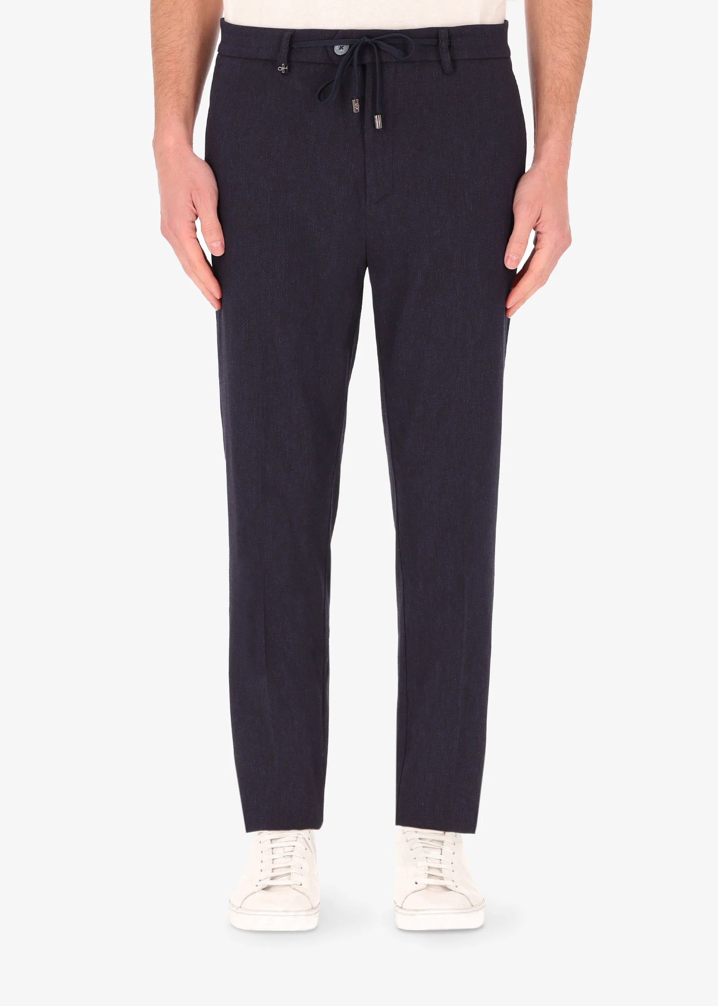 A front facing image of a model wearing the 32 York trousers Saul in blue from Distretto 12.