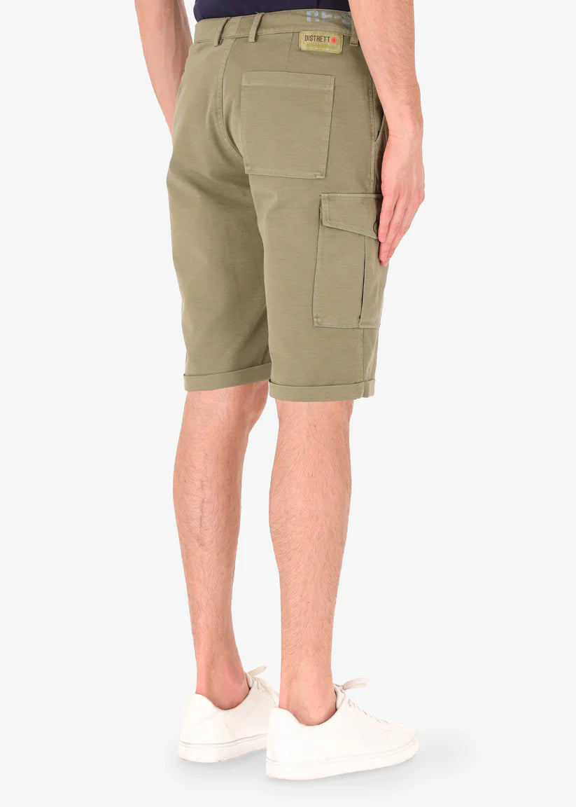 A rear image of a model wearing khaki reshaped cargo shorts from Distretto 12.