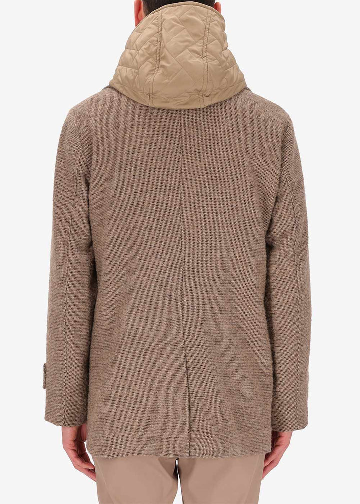 A back image of a model wearing Distretto12 peacoat Bicerin in Dove Grey, with a Dove Grey hood.