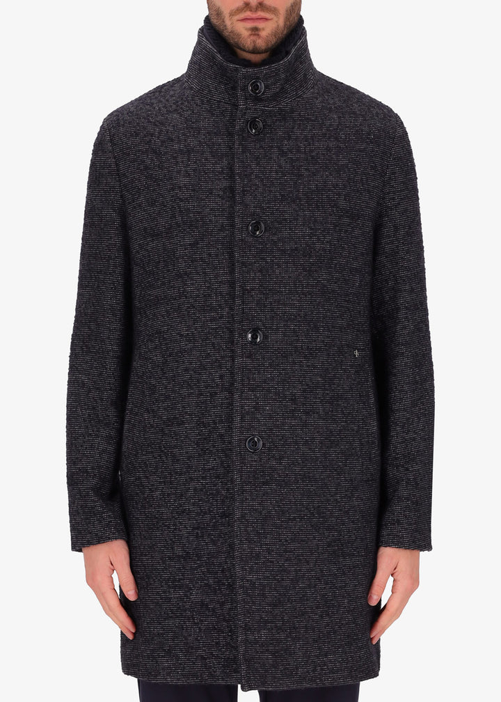 An image of a model wearing Distretto12 neck coat bicerin in grey with a blue chest insert.