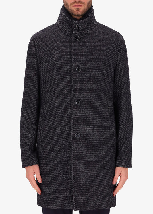 An image of a model wearing Distretto12 neck coat bicerin in grey with a blue chest insert.
