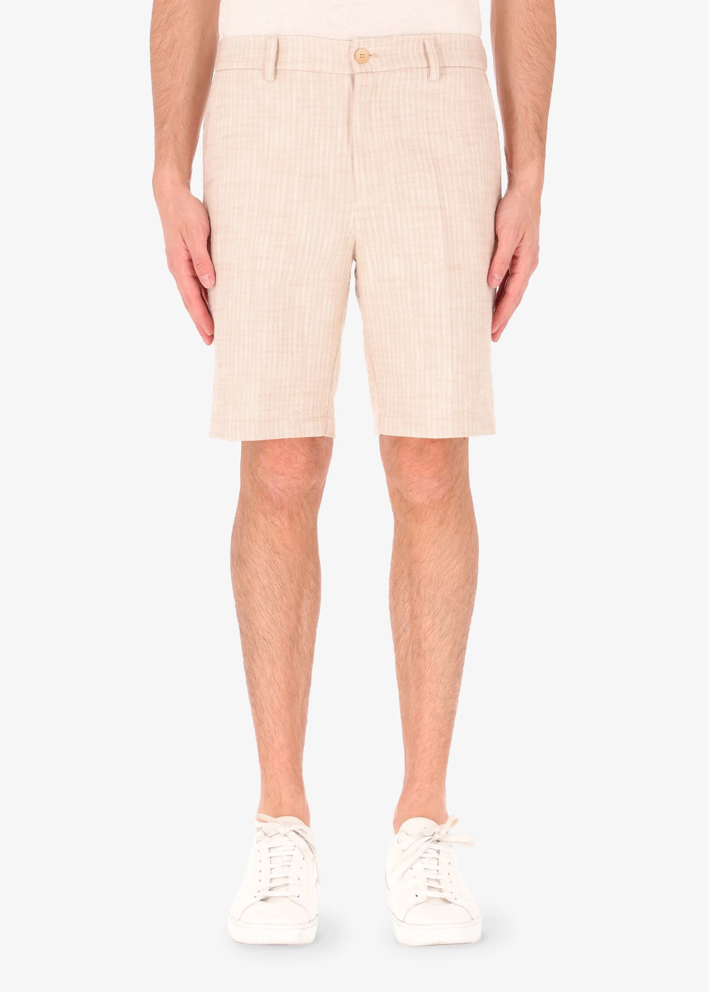 A front facing picture of a model wearing linen shorts from Distretto 12.