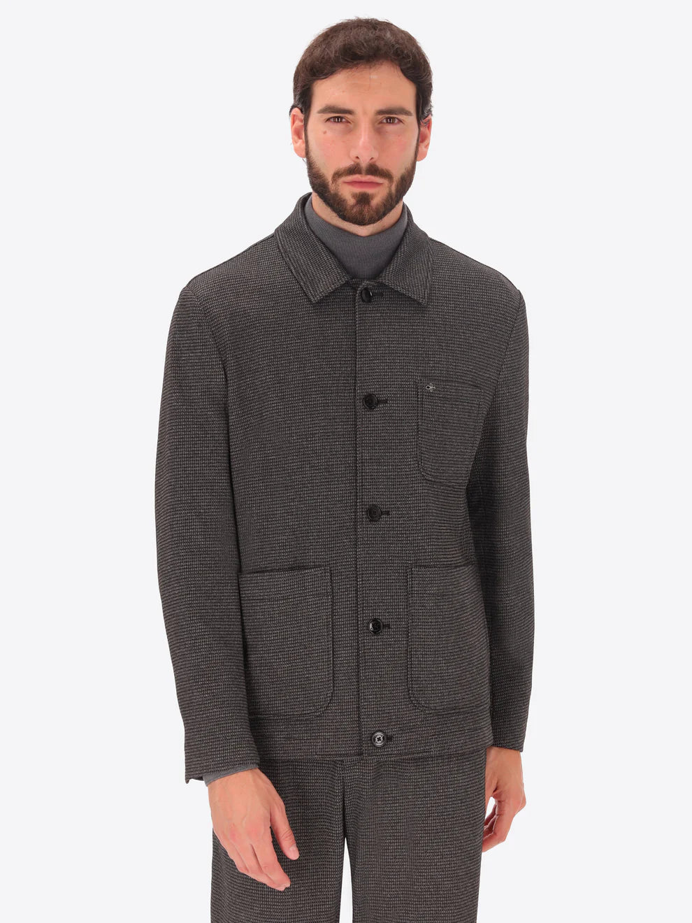 Male model wearing micro patterned shirt jacket suit by distretto12 in grey