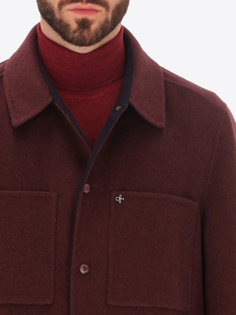 Male model wearing maroon collared coat by distretto12 with close up view
