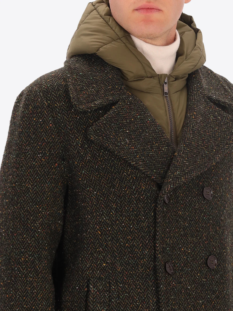 Male model wearing green peacoat with detachable hood insert by distretto12 with micro pattern with close up view