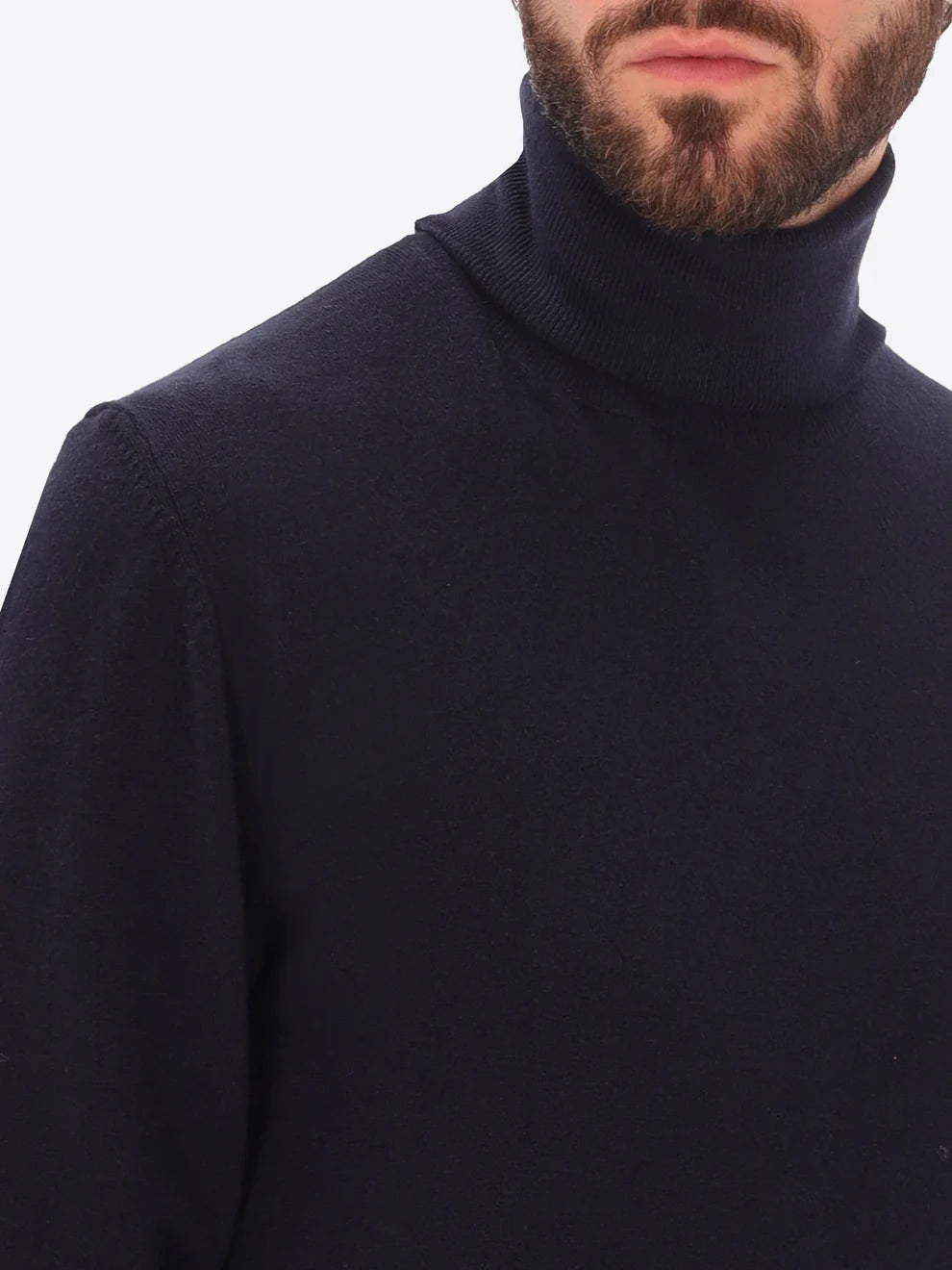 Male model wearing high neck knitwear by distretto12 in navy with close up view
