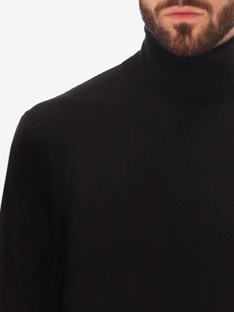 Male model wearing high neck merino blend knitwear by distretto12 in black with close up view