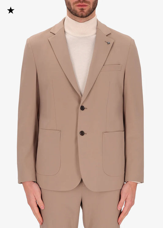 An image of a model wearing a Distretto12 jacket H.P in Sandalwood.