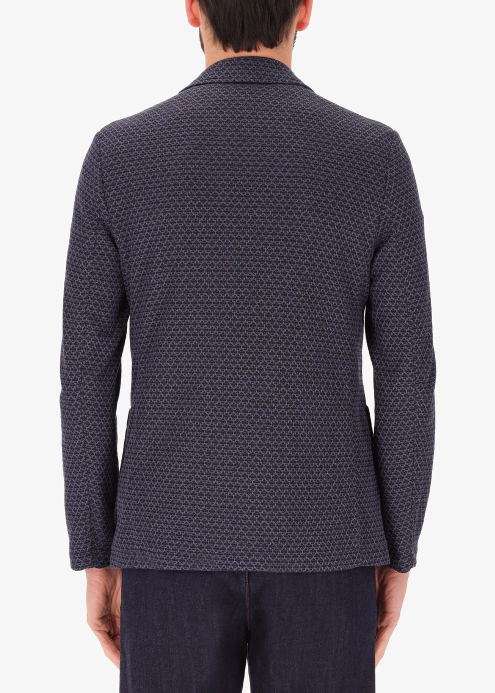 A back facing image of a model wearing Distretto 12 Jacket Gallia.