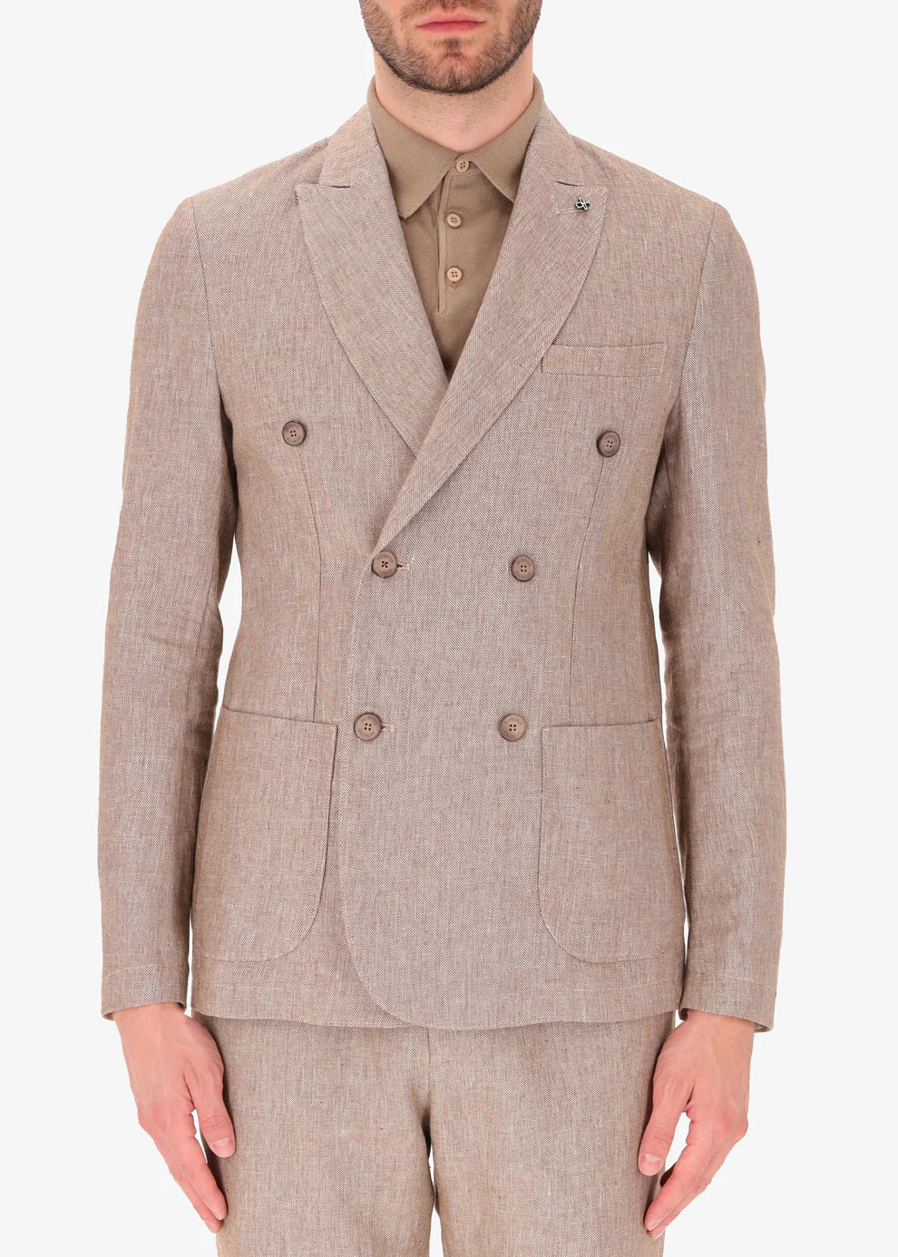 A front facing picture of a model wearing a linen double breasted blazer from Distretto 12.
