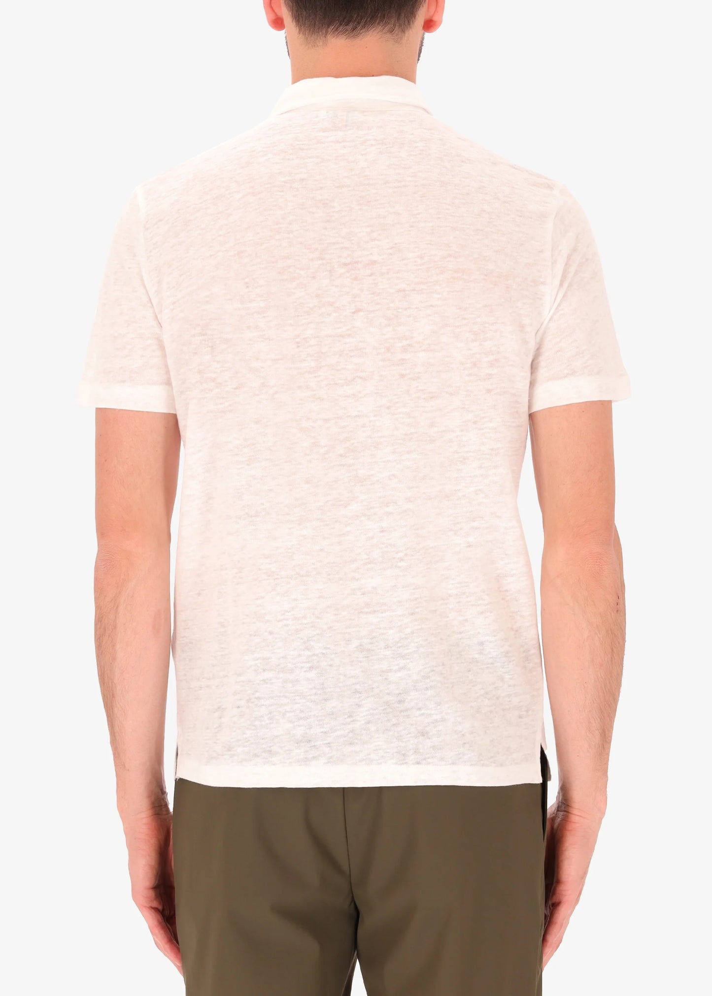 A picture of a model wearing a white linen polo from Distretto 12 from the rear.