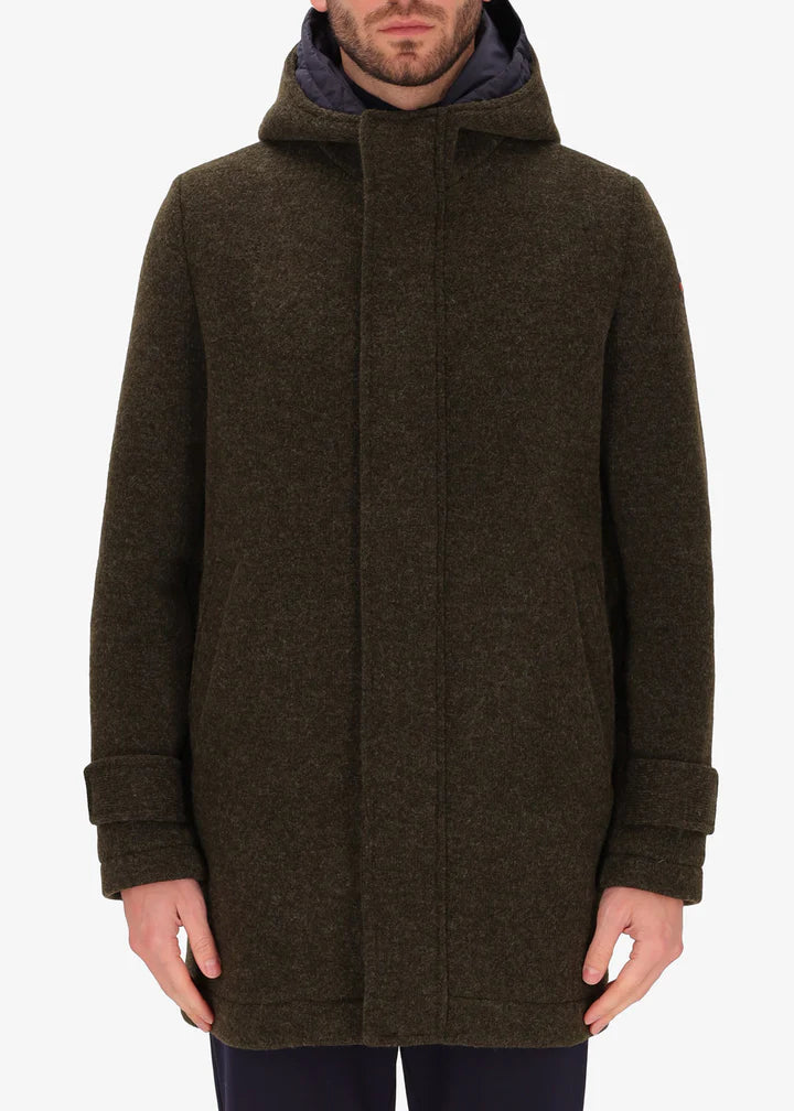 An image of a model wearing Distretto12 parka coat Valentino in Tobacco, with a blue hood.