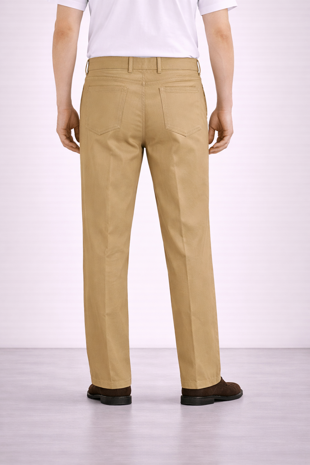 An image from behind of a model wearing Germano 1952 tan chinos with a pleat.