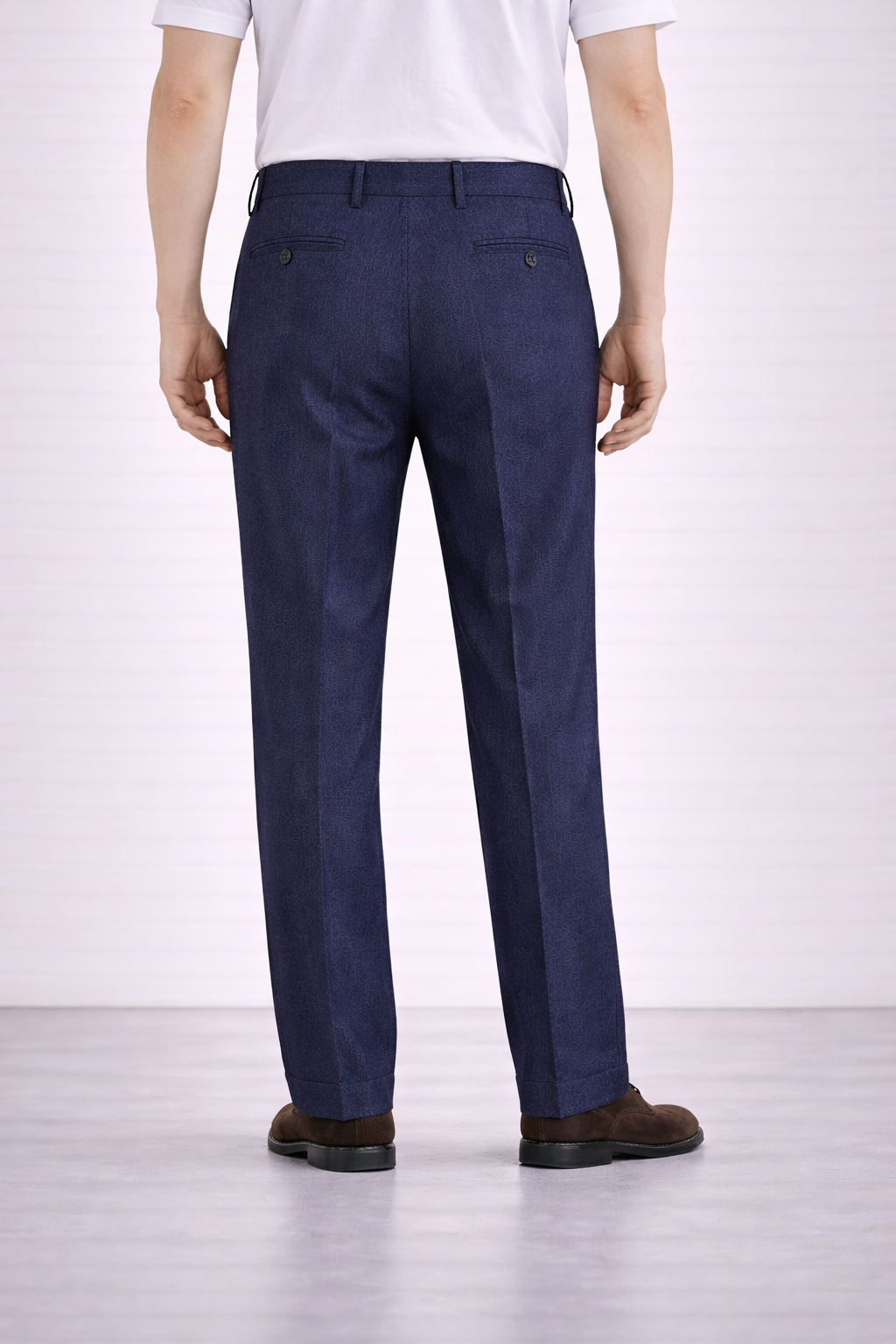 A back facing image of a model wearing Germano 1952 navy trousers with a single pleat.