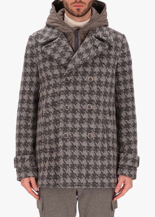 A picture of a model wearing a Distretto12 Peacoat Lingotto in Dove Grey, with a grey hood.