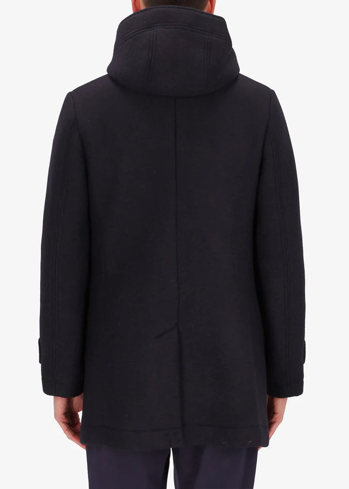 A back facing image of a model wearing Distretto 12 parka coat Carlos in navy.