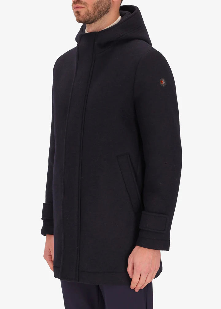 An side facing image of a model wearing Distretto 12 parka coat Carlos in navy.