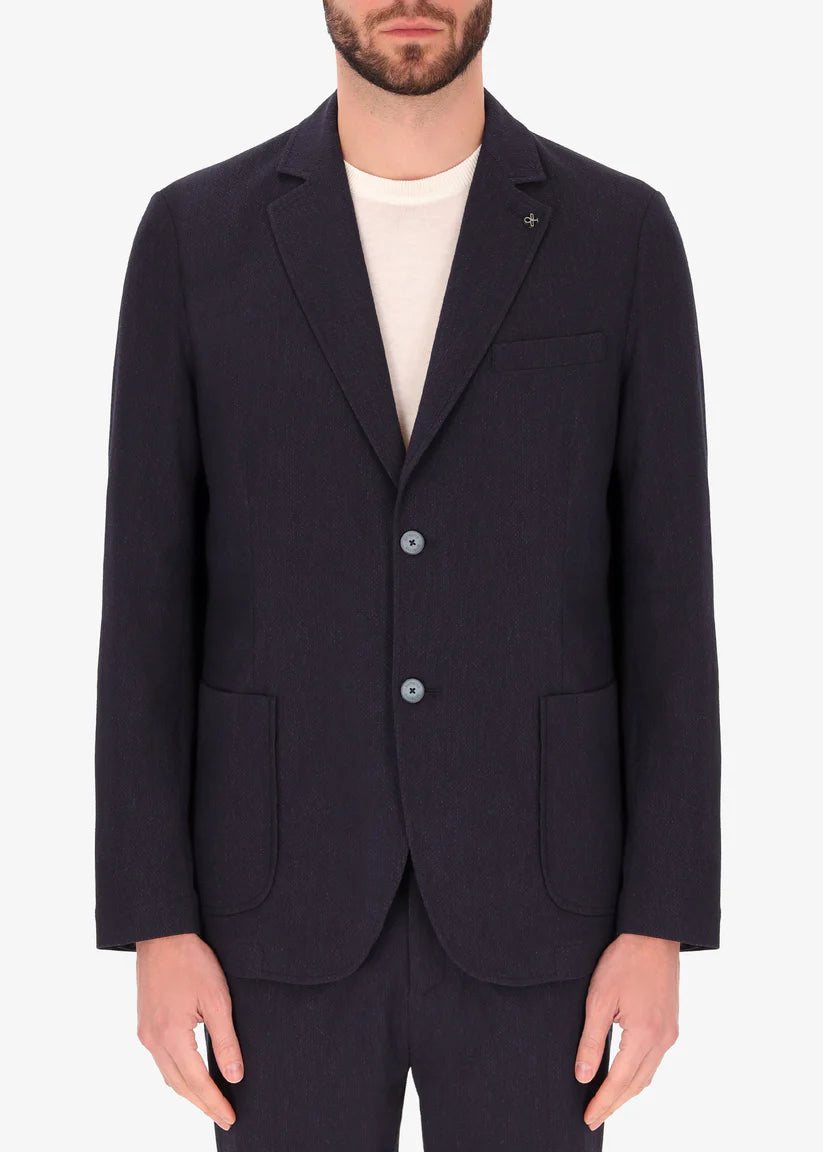 A front facing image of a model wearing Jacket Saul in blue from Distretto 12.