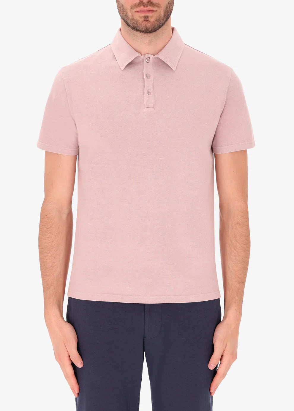 An image of a model wearing polo versilia in pink from Distretto 12.