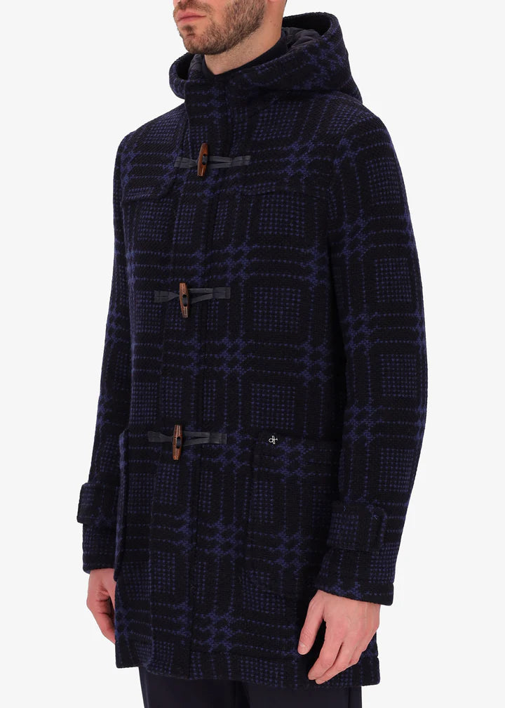 A side facing image of a model wearing Distretto tartan piquard coat in navy