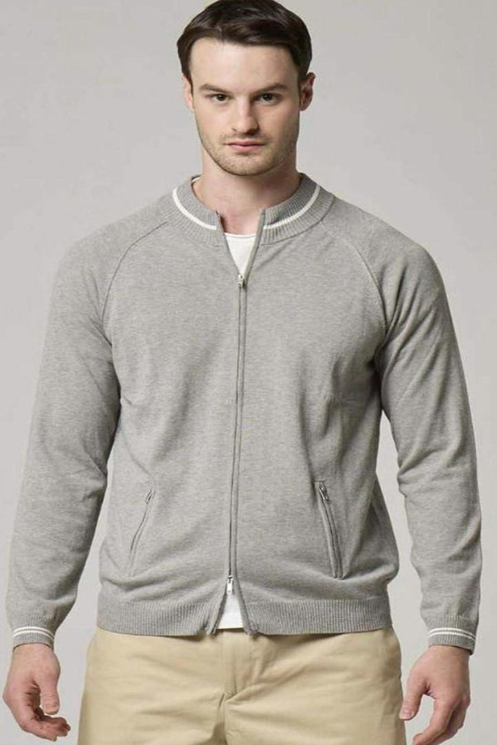 An image of a model wearing a Wool&Co full zip cardigan in grey cotton.
