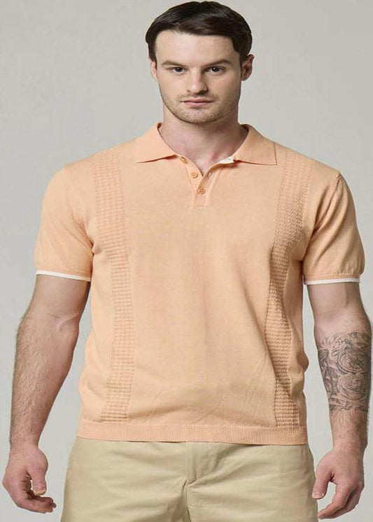 An image of a model wearing a Wool&Co polo in sunset in sunset.