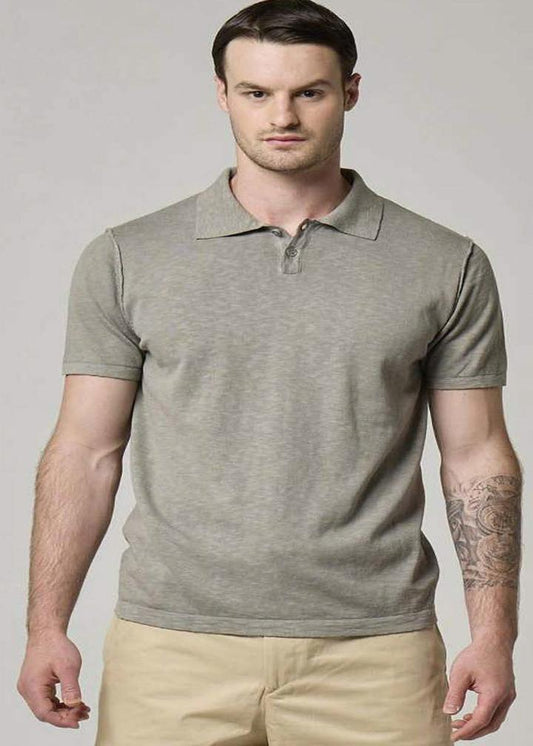 A picture of a model wearing a grey Wool&Co polo in grey.