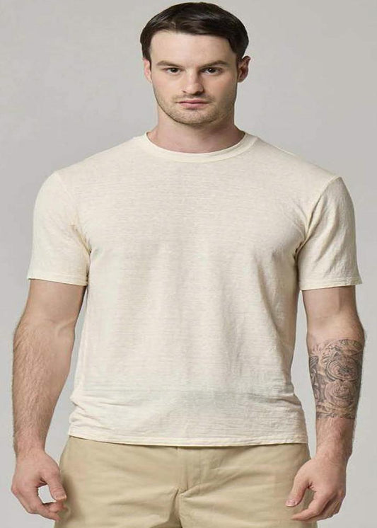 A picture of a model wearing a Wool&Co linen T-shirt in cream.