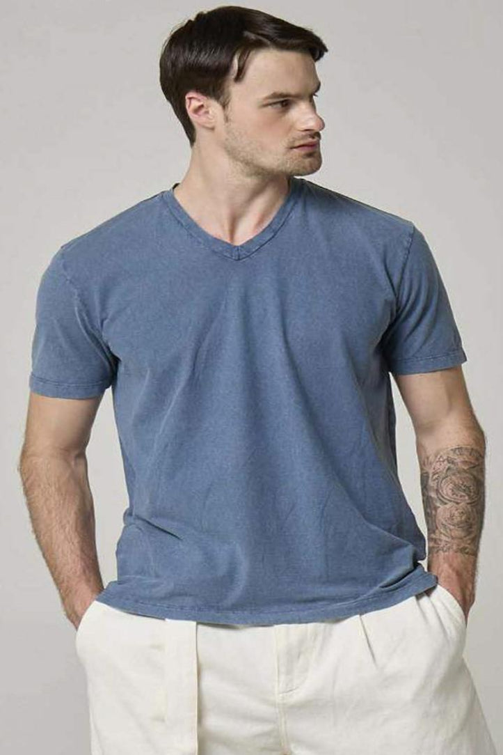A picture of model wearing v neck in blue.
