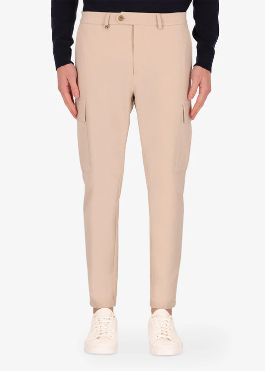 An image of a model wearing Distretto12 cargo newman trousers in cream.