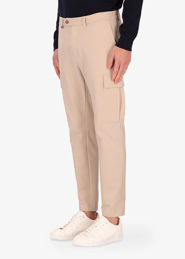 An image of a model wearing Distretto12 cargo newman trousers in cream.