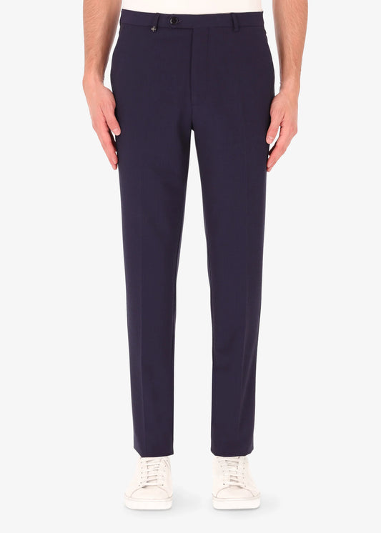 A front facing image of a model wearing Distretto 12 Tailoring tech Firenze Trousers.