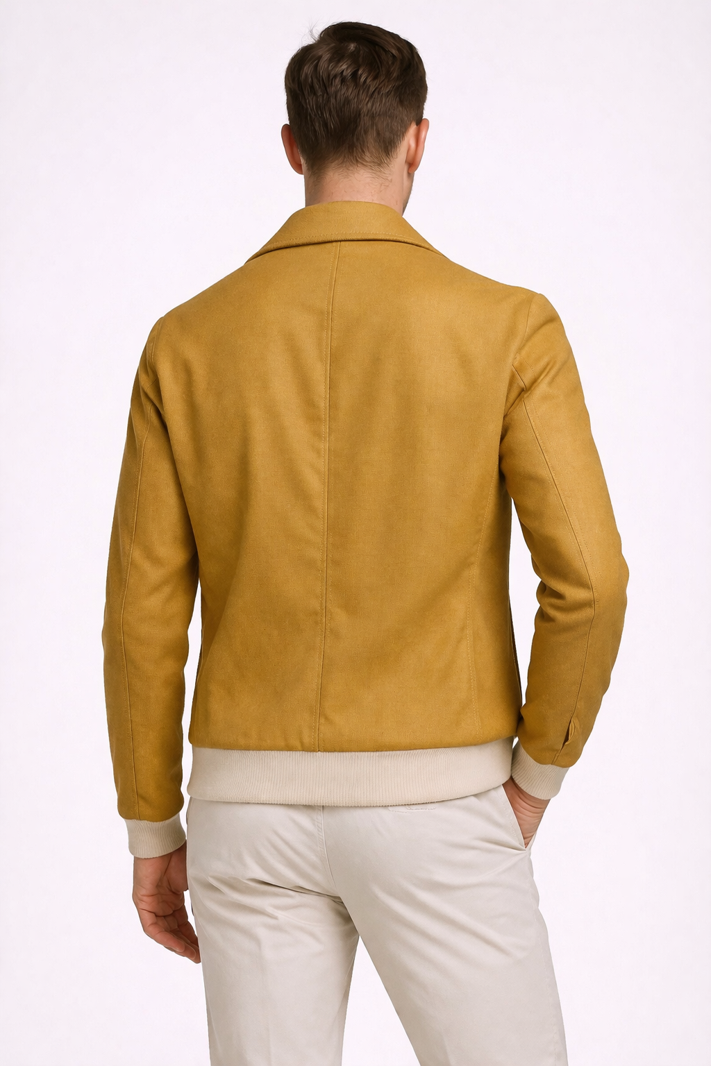 A model wearing an aviator jacket with zipper in mustard from RPL from behind