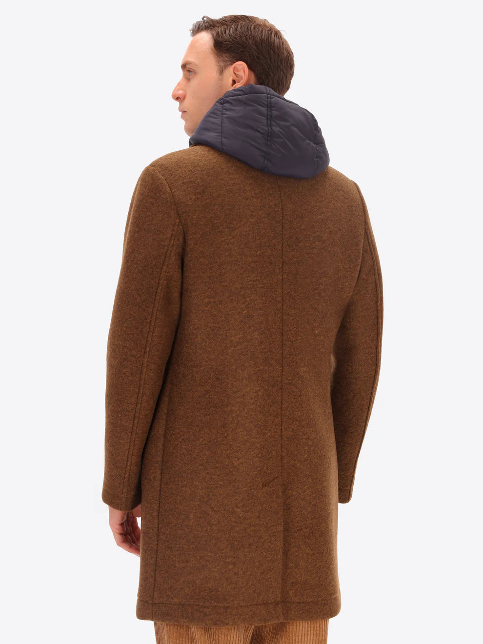 Male model wearing tobacco coloured overcoat by distretto12 with detachable hood with back view