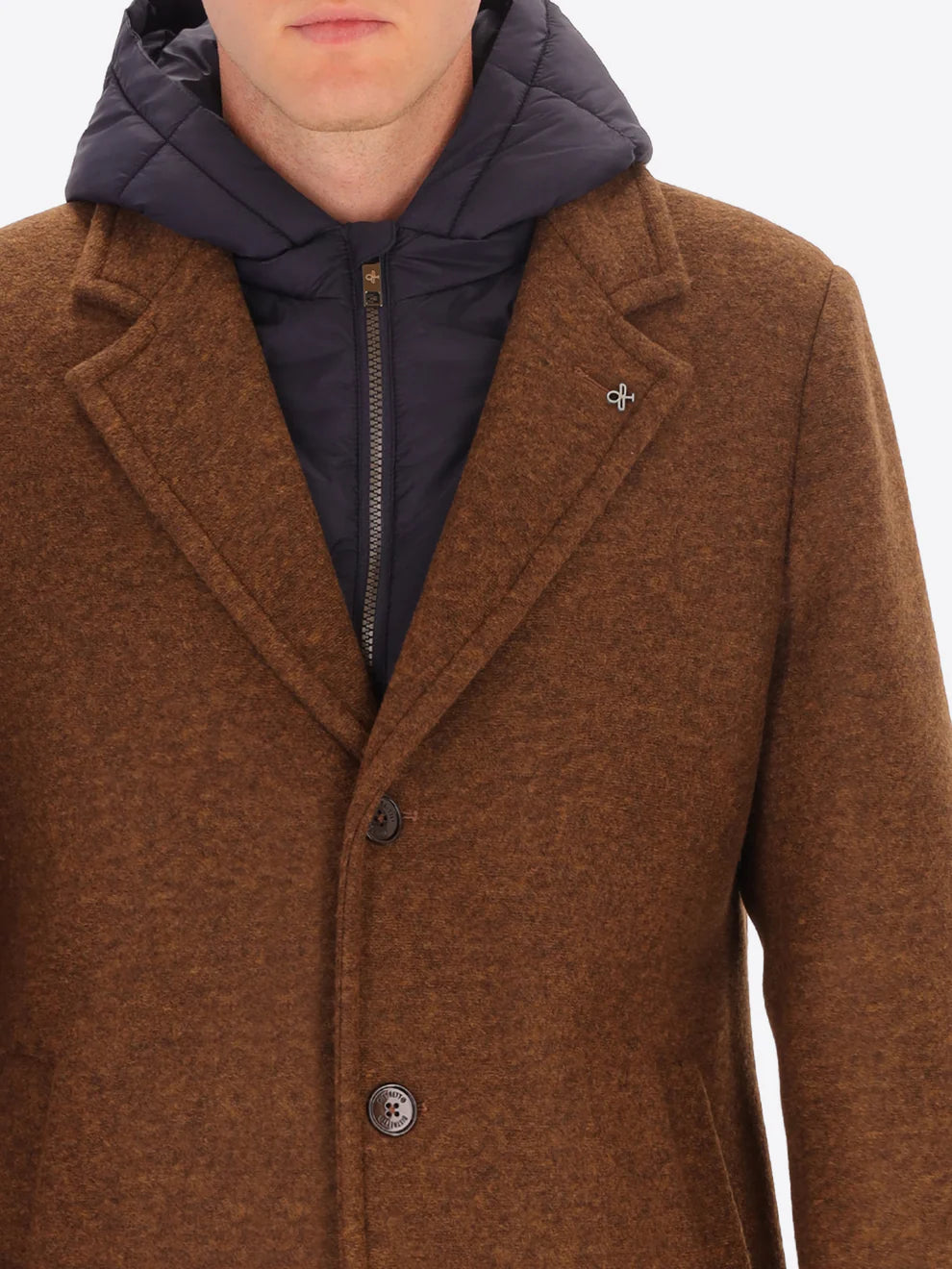 Male model wearing tobacco coloured overcoat by distretto12 with detachable hood with close up view
