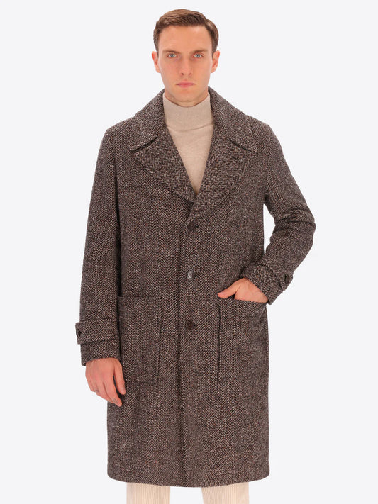 Male model wearing tobacco coloured overcoat by distretto12 with micro pattern