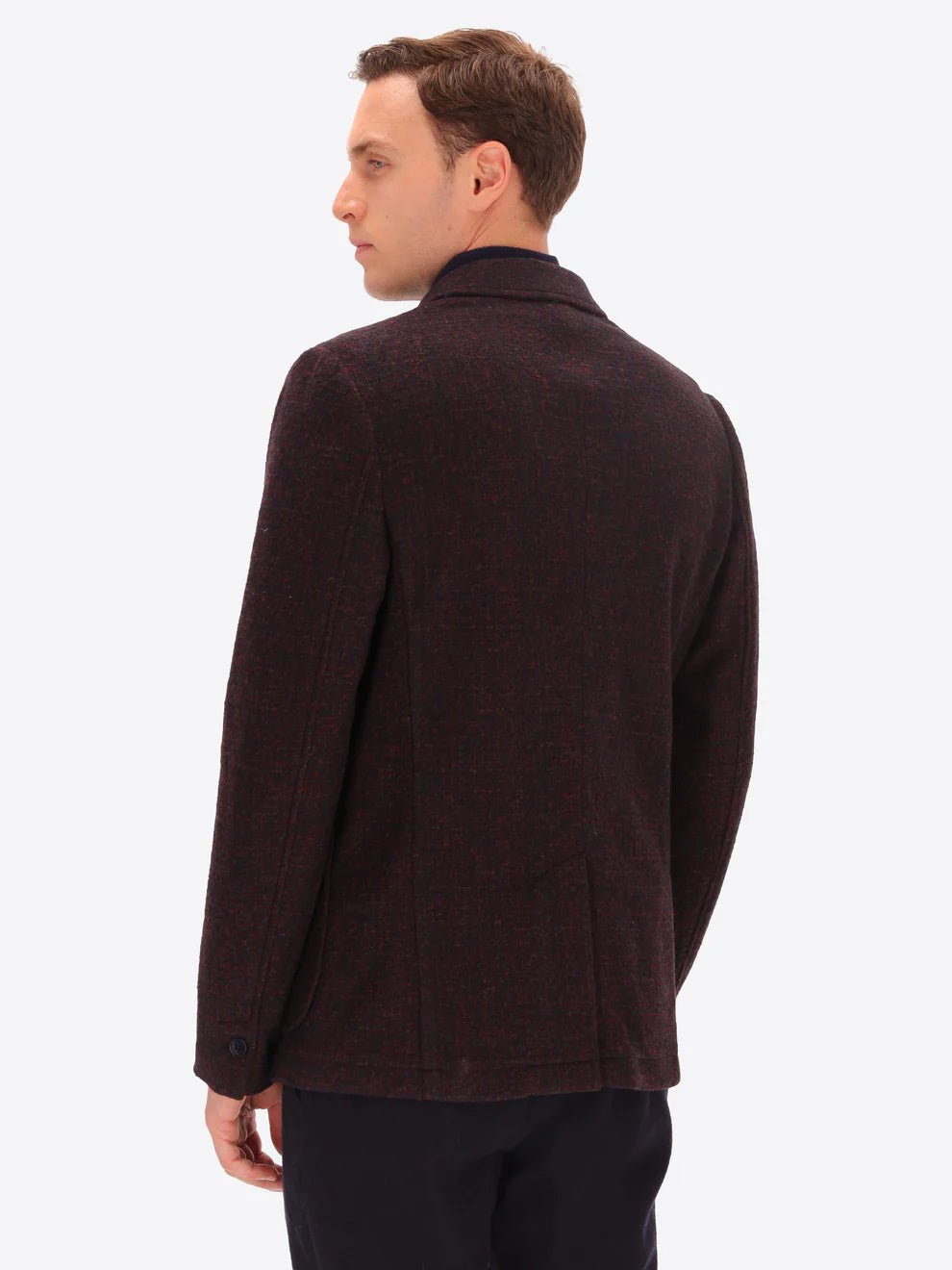 Male model wearing wool blend  jacket in maroon by distretto12 with back turned