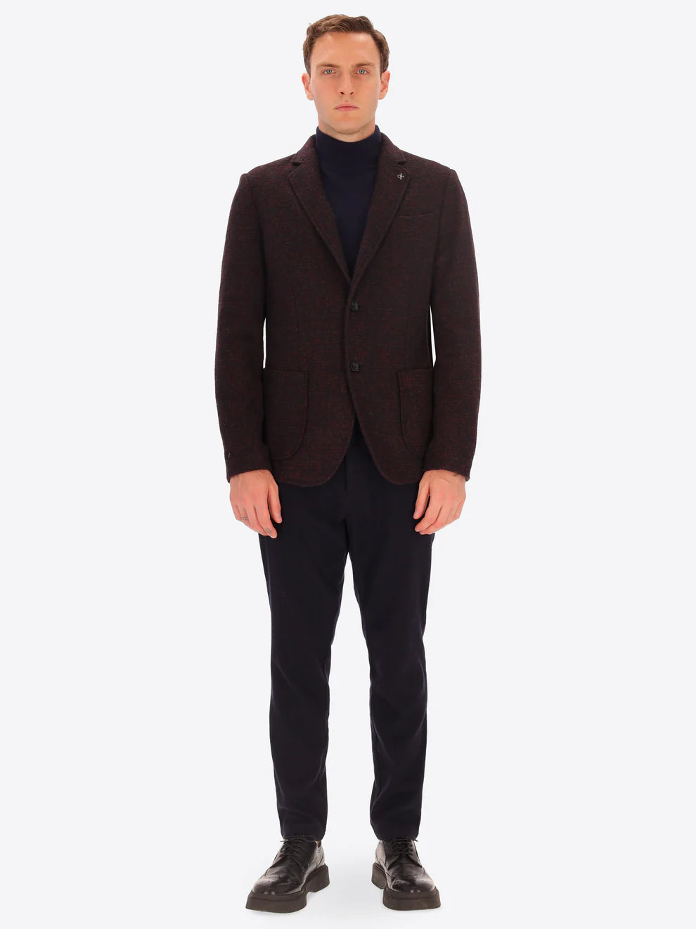 Male model wearing wool blend  jacket in maroon by distretto12 with navy trousers