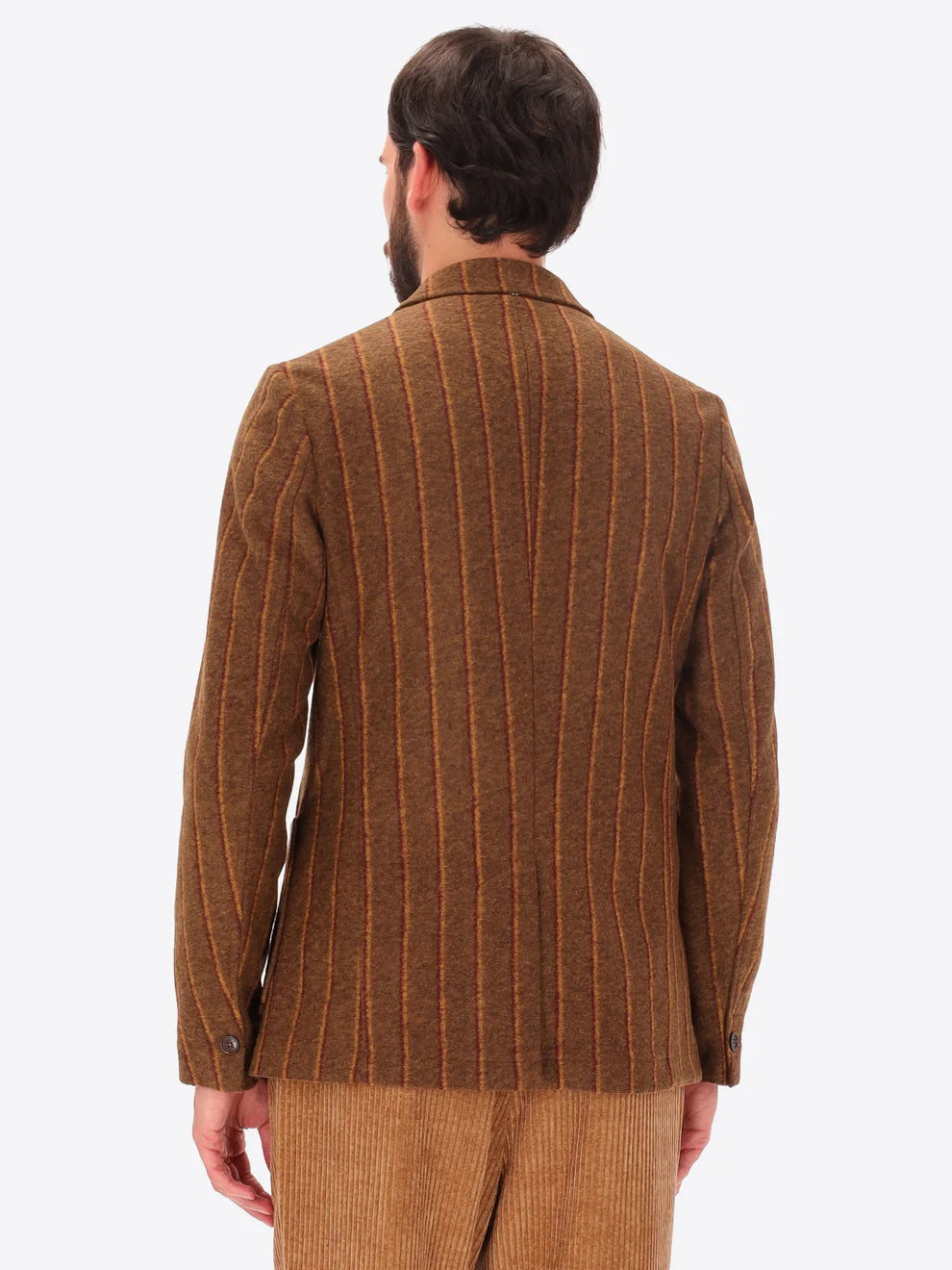 Male model wearing wool blend striped brown jacket by distretto12 with back turned