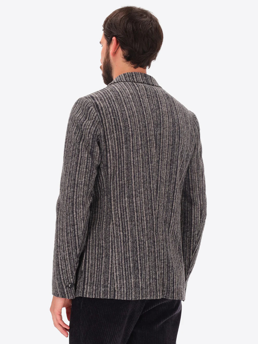 Male model wearing wool blend striped grey jacket by distretto12 with back turned