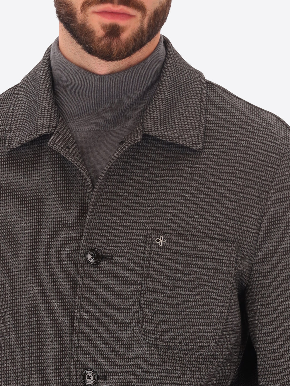 Male model wearing micro patterned shirt jacket by distretto12 in grey with close up view