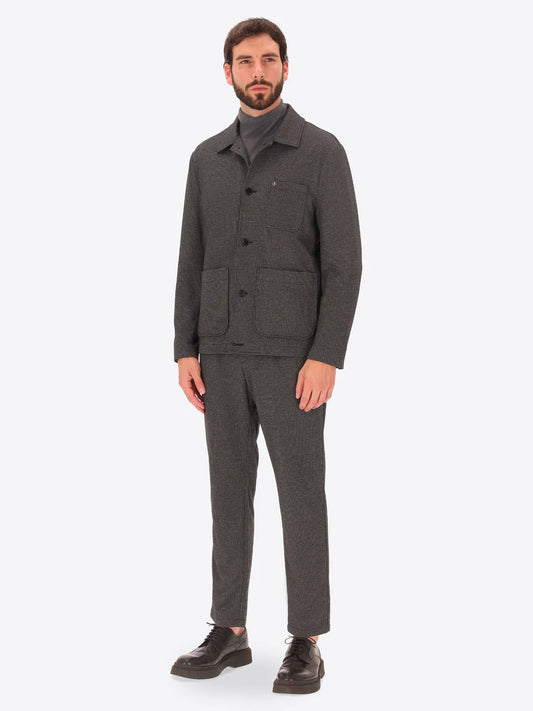 Male model wearing micro patterned shirt jacket by distretto12 in grey