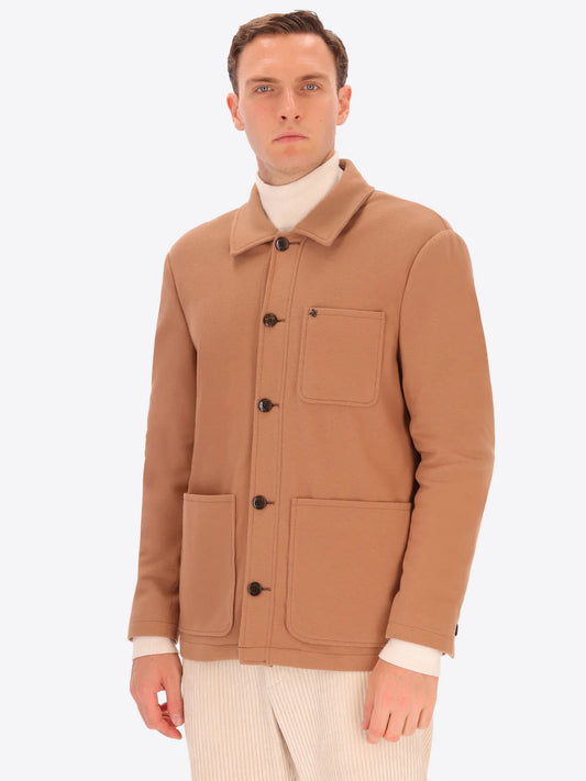 Male model wearing soft shirt jacket by distretto12 in camel colour