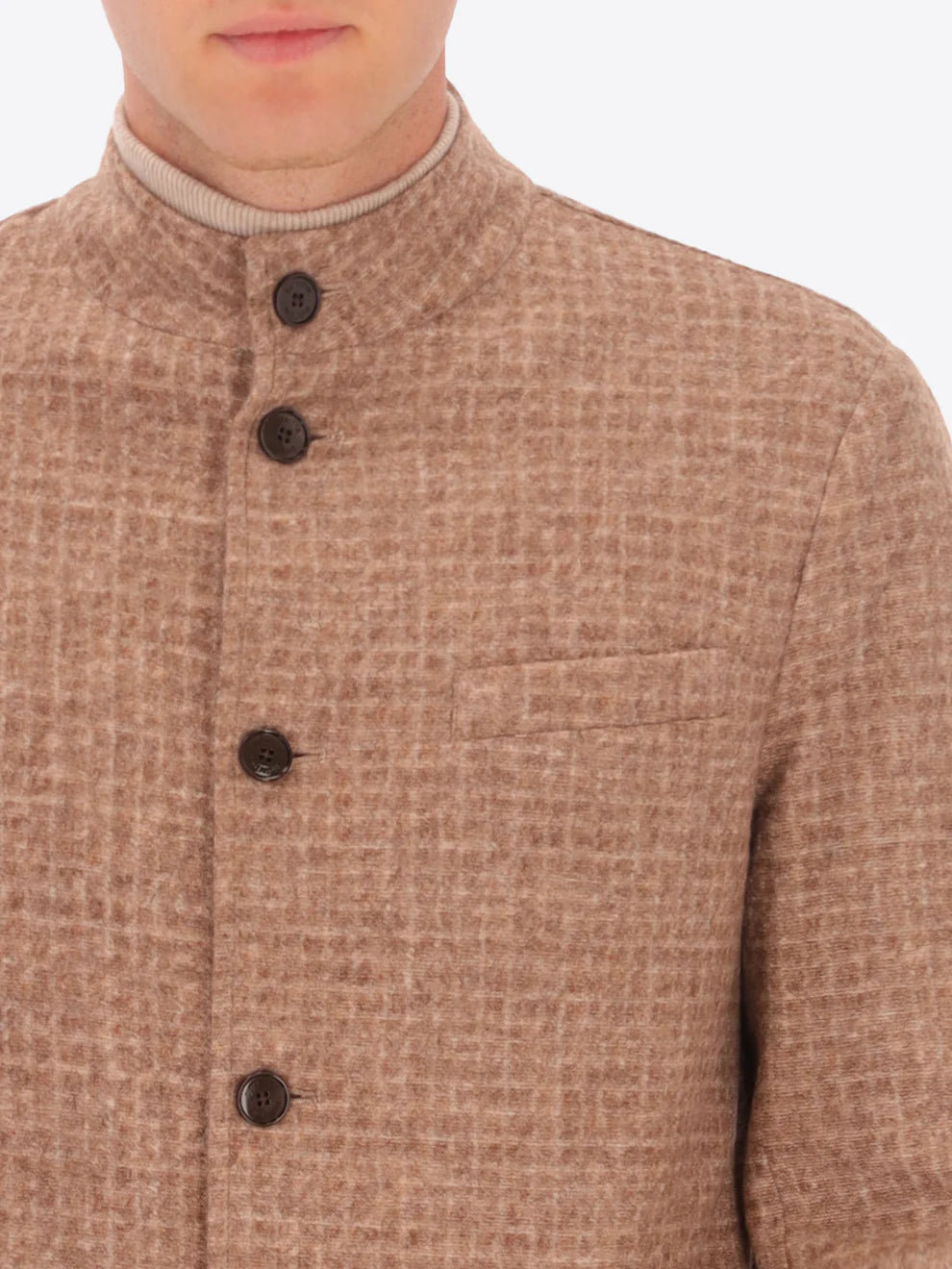 Male model wearing wool blend coreana jacket with light brown tartan design by distretto12 with buttons showing