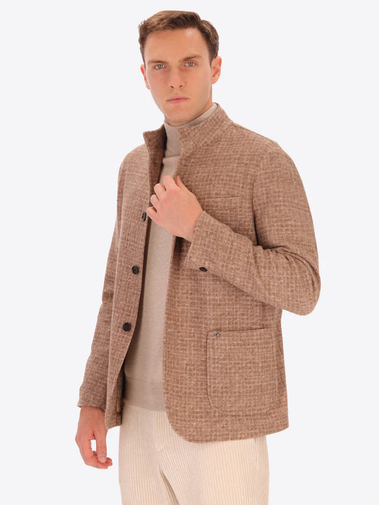 Male model wearing wool blend coreana jacket with light brown tartan design by distretto12 