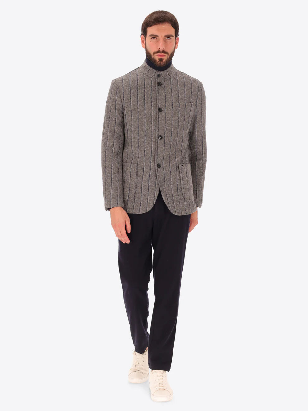 Male model wearing wool blend striped grey coreana style jacket by distretto12 with blue trousers