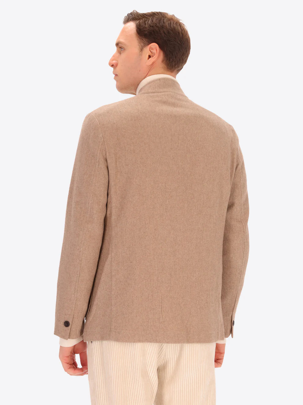Male model wearing wool blend coreana style distretto12 jacket in dove grey with back turned