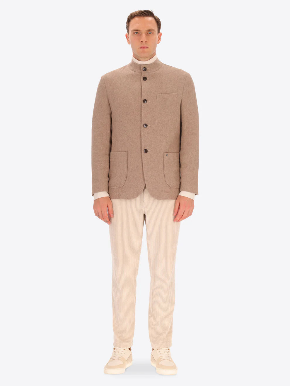 Male model wearing wool blend coreana style distretto12 jacket in dove grey with cream corduroy trousers