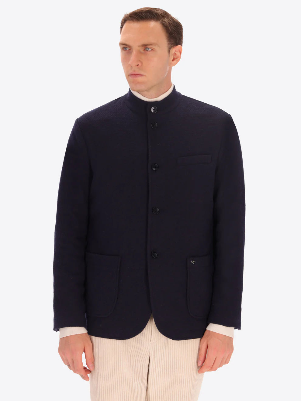 Navy knitted Distretto12 coreana jacket on a male model