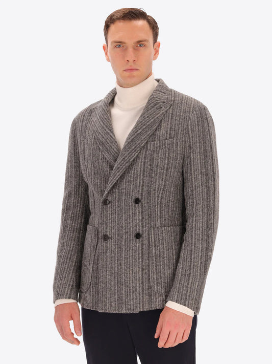 Male model wearing wool blend double breasted jacket in grey by distretto12 